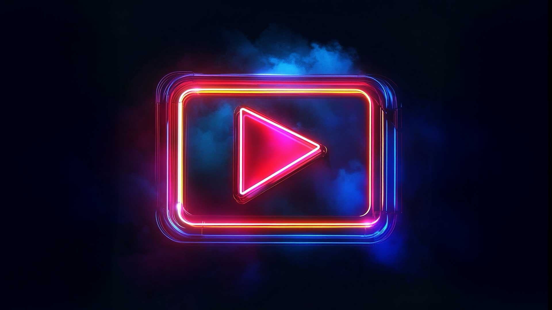 A neon play button icon glowing in pink and blue against a dark background. The icon is surrounded by a subtle haze, emphasizing a modern and dynamic approach to digital video content.